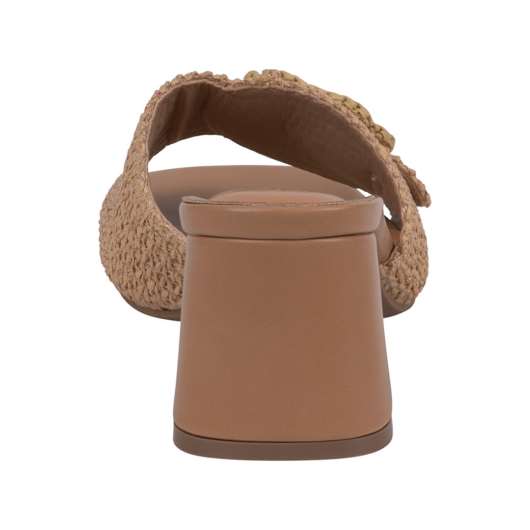 Brown sandal with textured strap on a white background