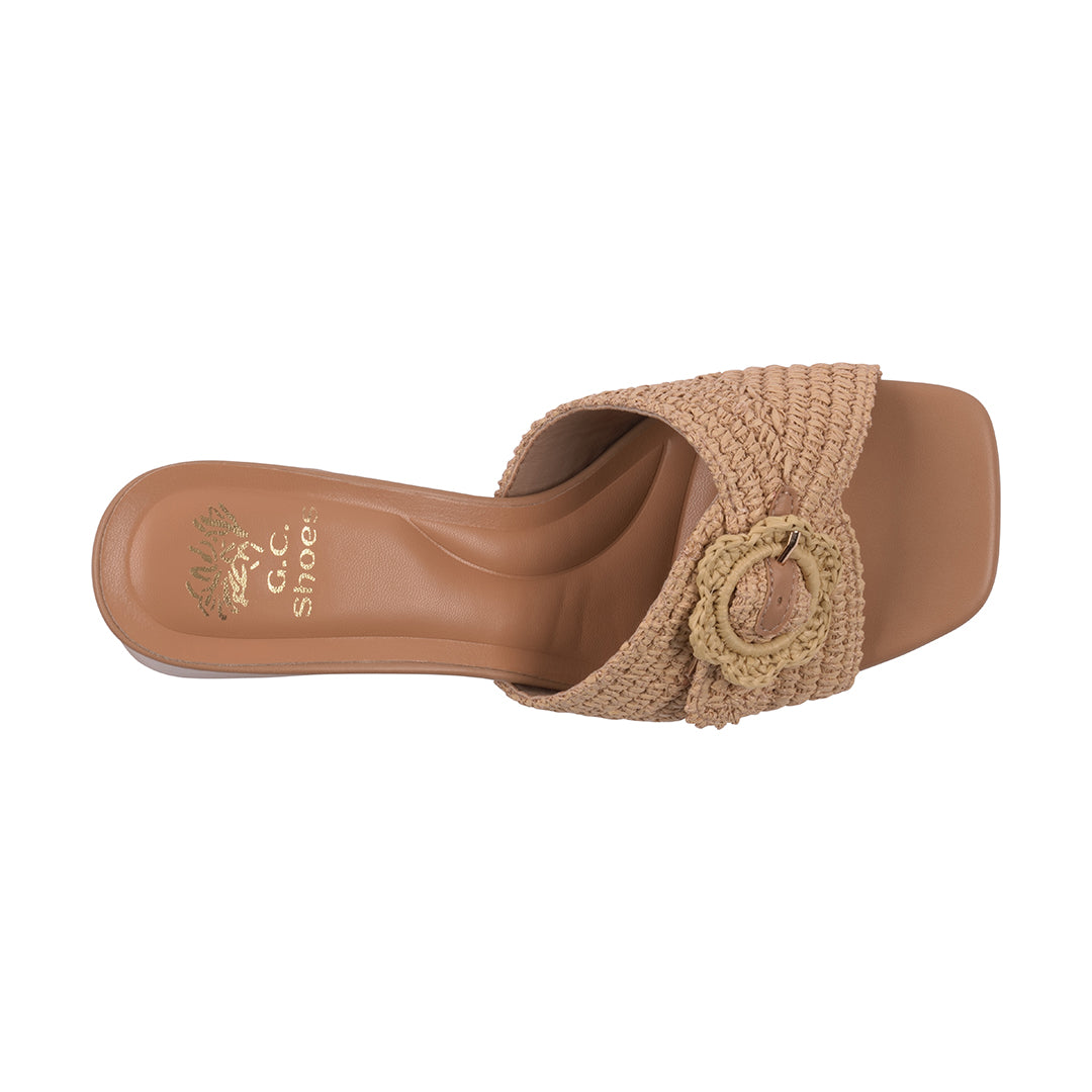 Brown sandal with woven design on a white background