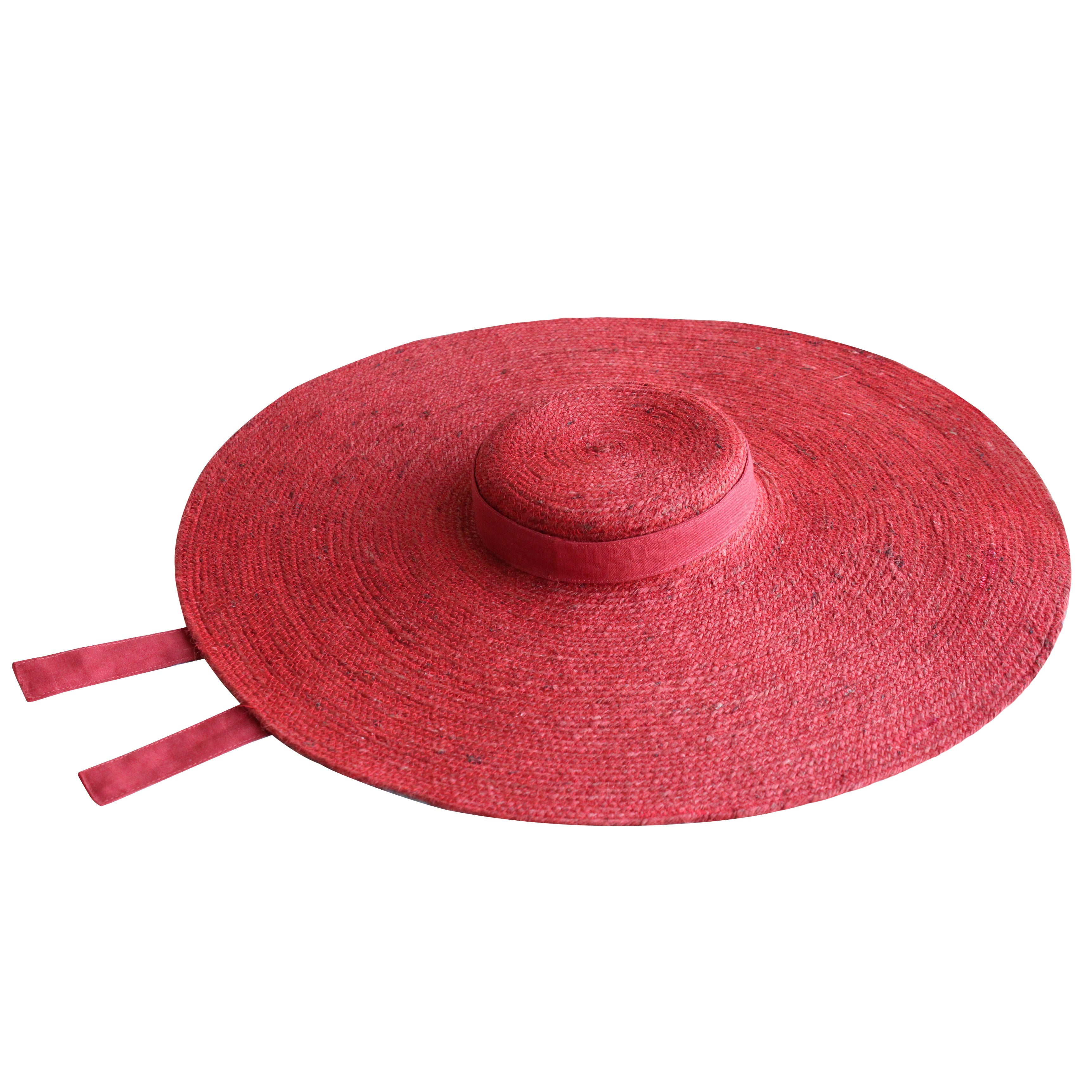 Red sun hat with a wide brim on a white background