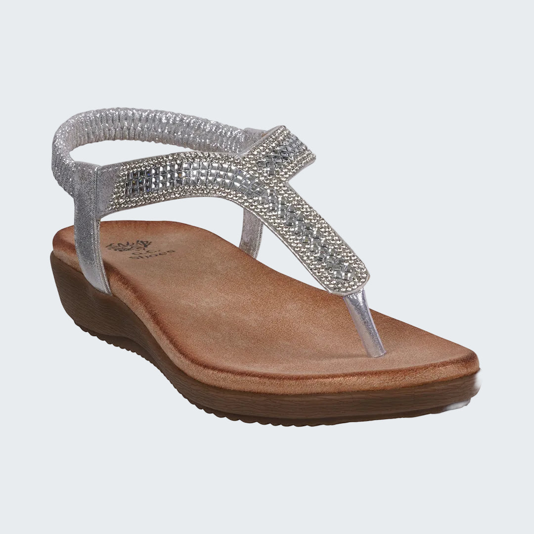 Silver sandal with a brown sole on a white background