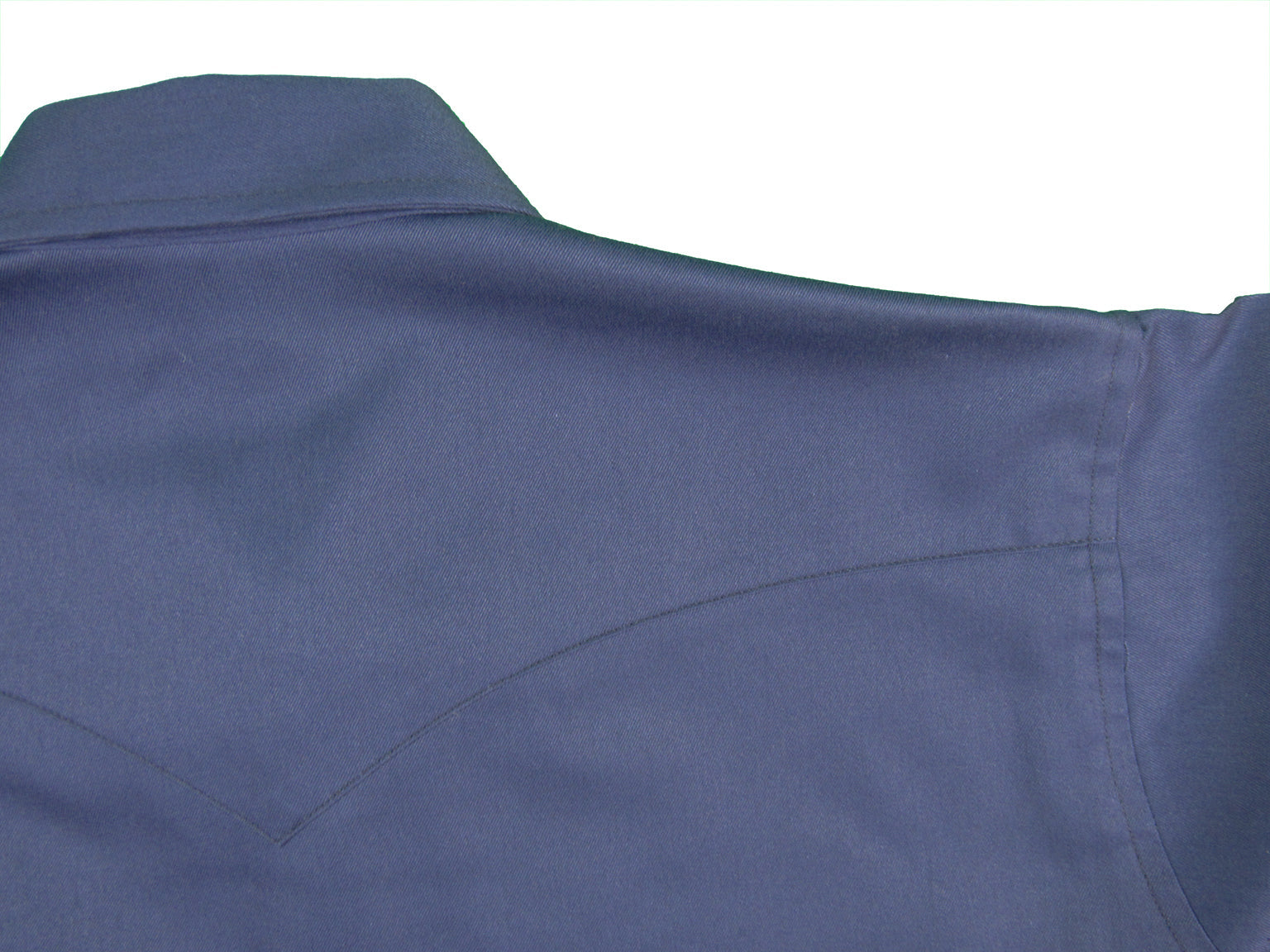 Close-up of a blue shirt collar on a white background