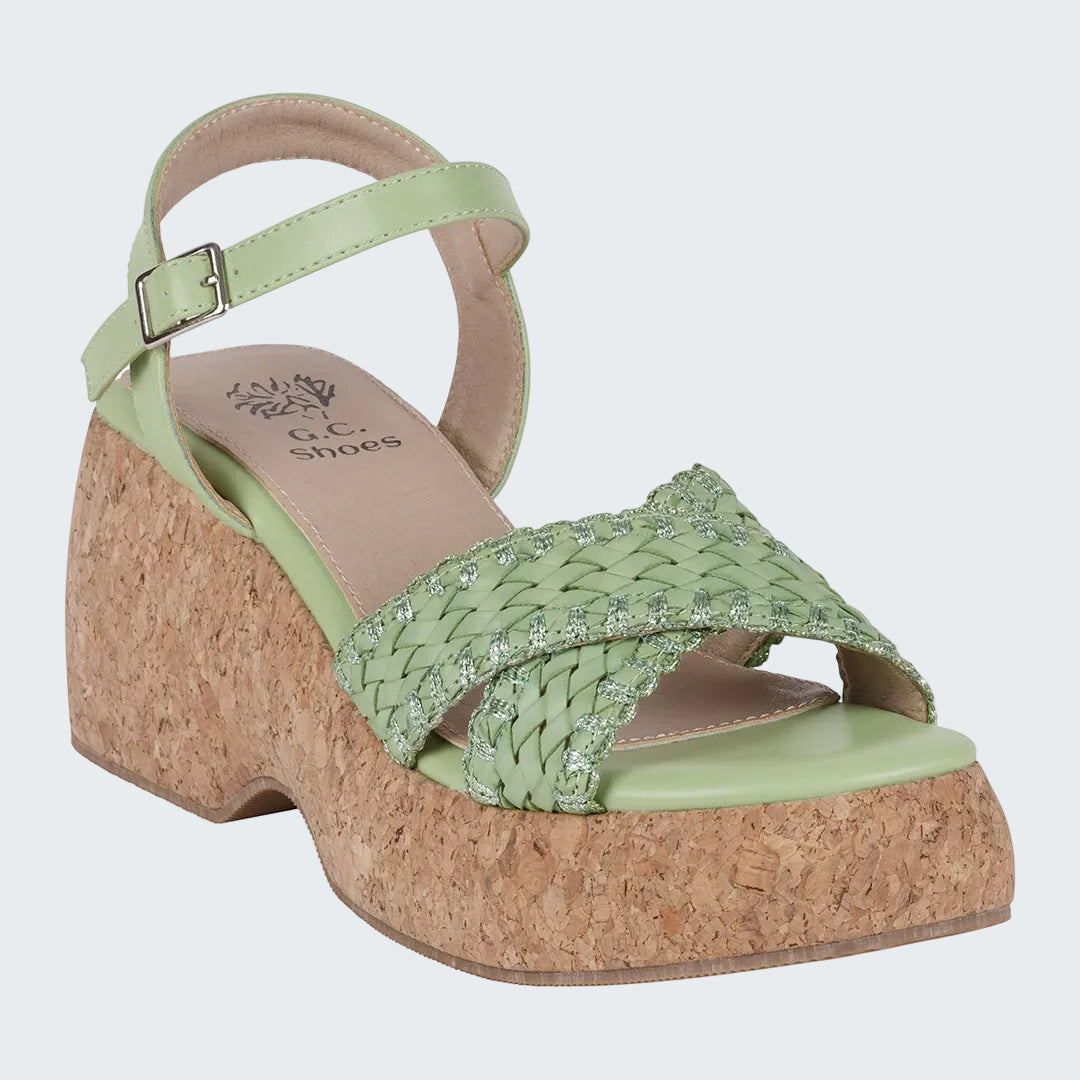 Green wedge sandal with cork sole on a white background