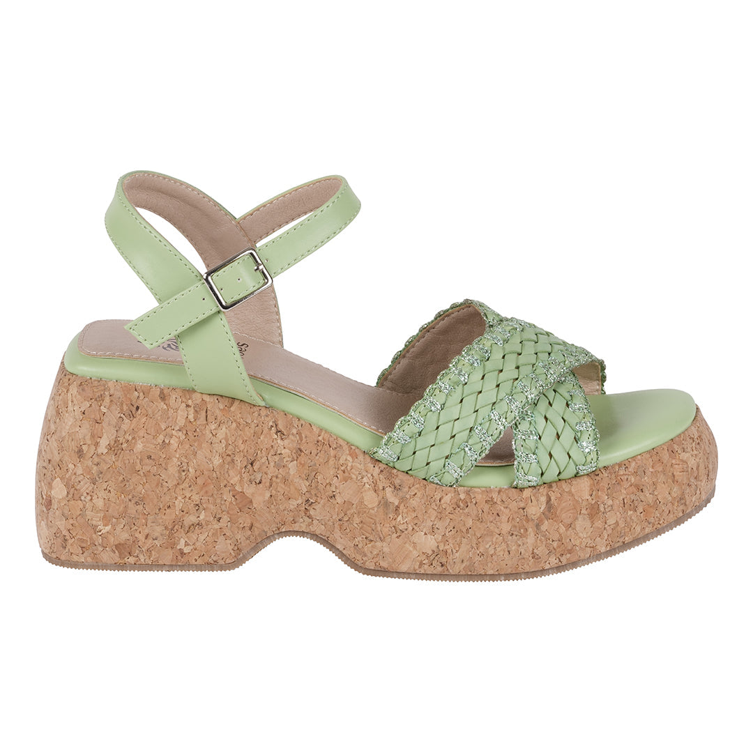 Green wedge sandal with cork sole on a white background