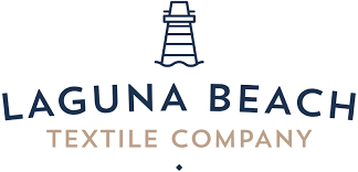 Logo of Laguna Beach Textile Company with a lighthouse icon.