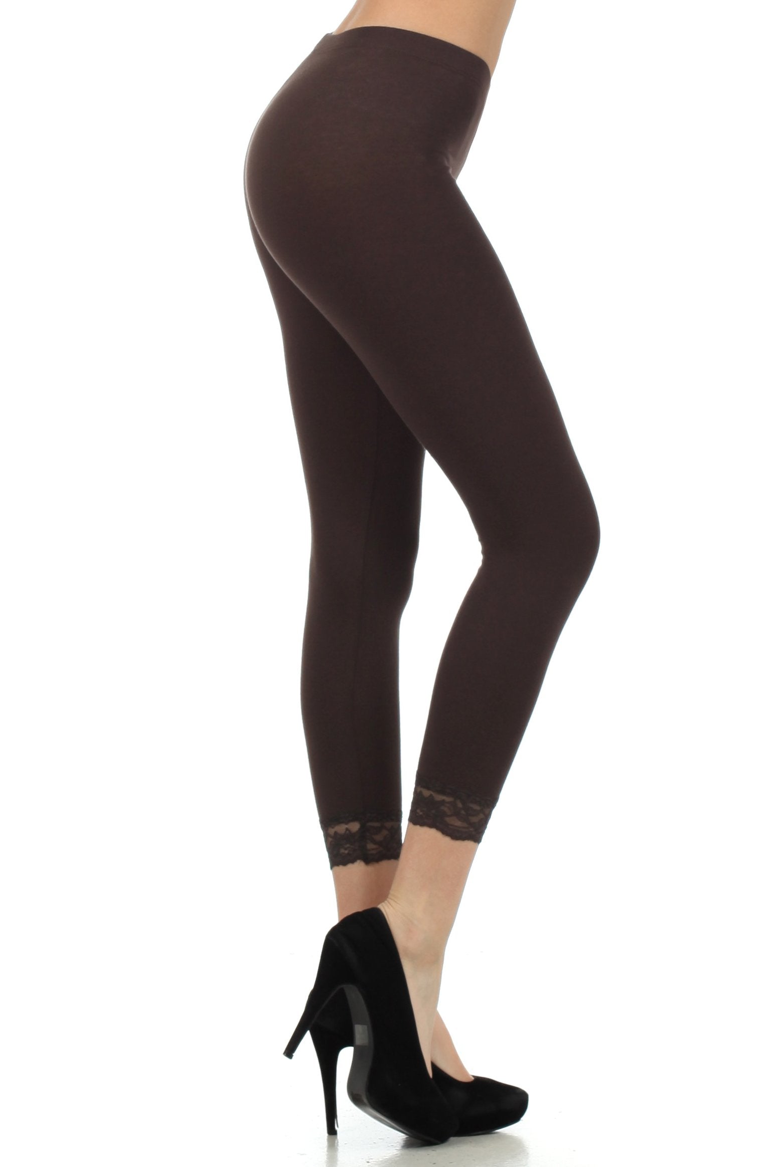 Dark brown leggings worn by a person on a white background