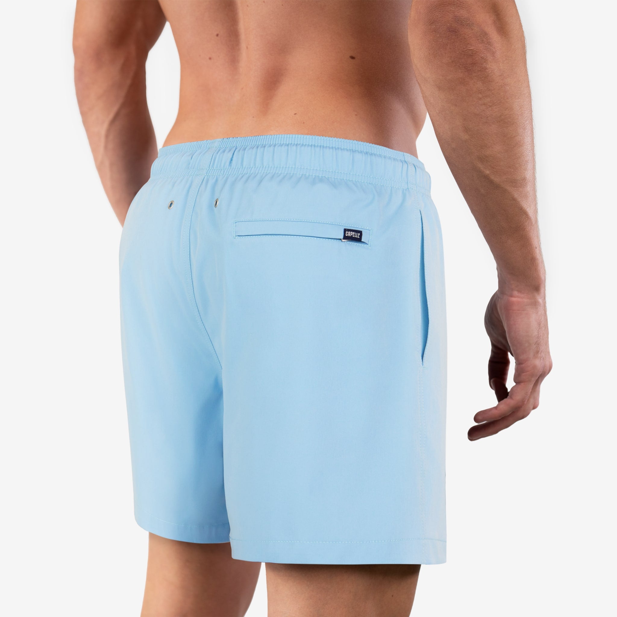 Light blue swim shorts worn by a person on a white background
