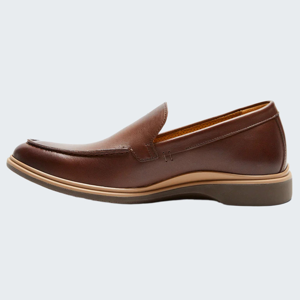 Brown leather loafer shoe on a white background
