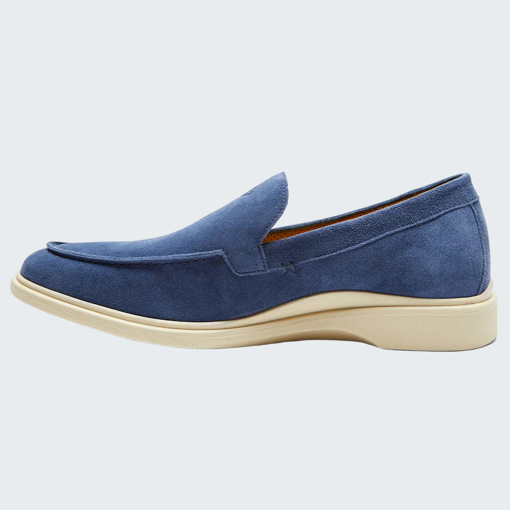 Blue loafer shoe on a white background