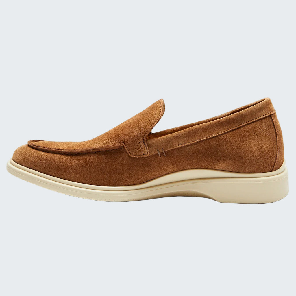Brown suede loafer shoe on a white background