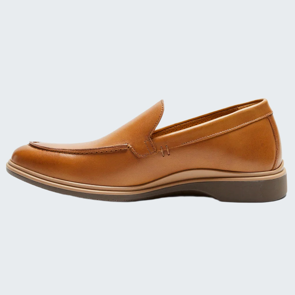Brown leather loafer shoe on a white background