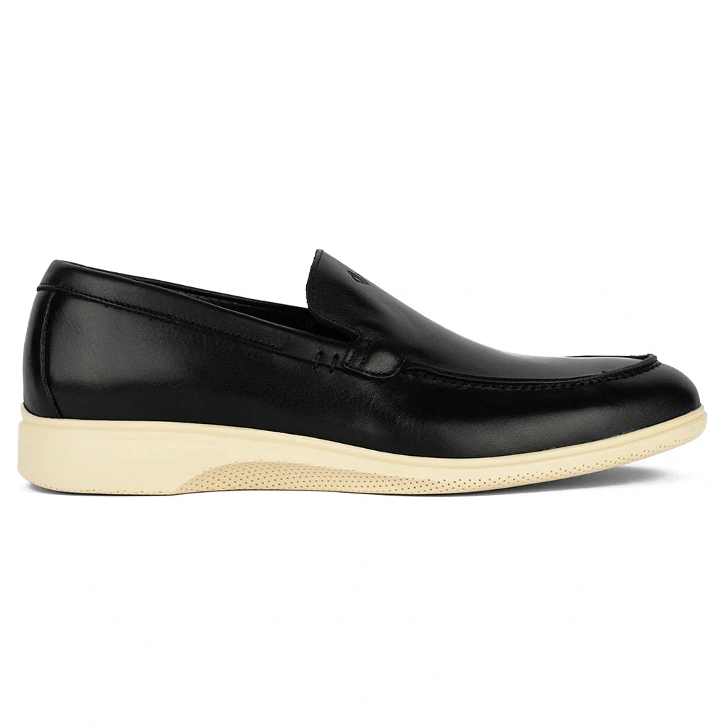 Black loafer shoe with a white sole on a white background