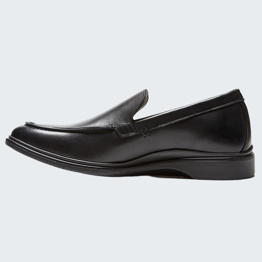 Black loafer shoe on a white background