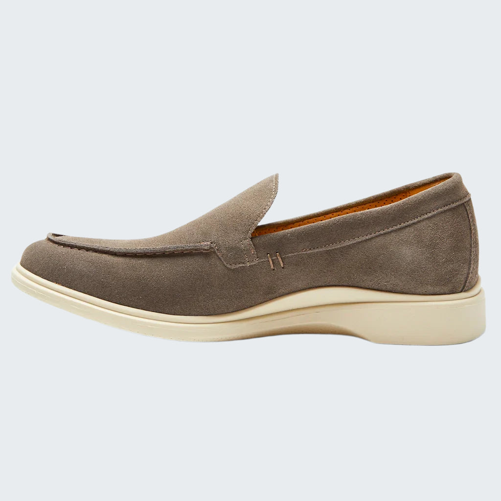 Brown suede loafer shoe on a white background