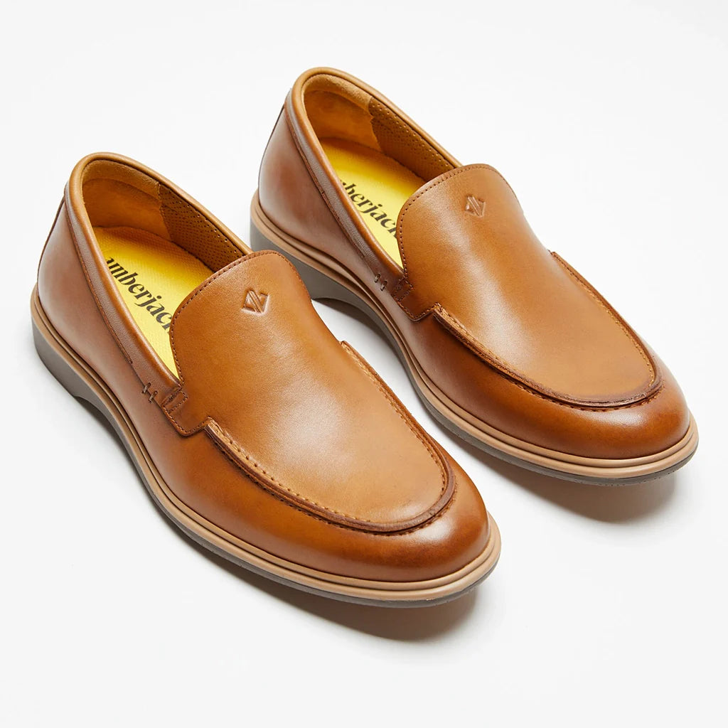 Pair of brown loafers on a white background