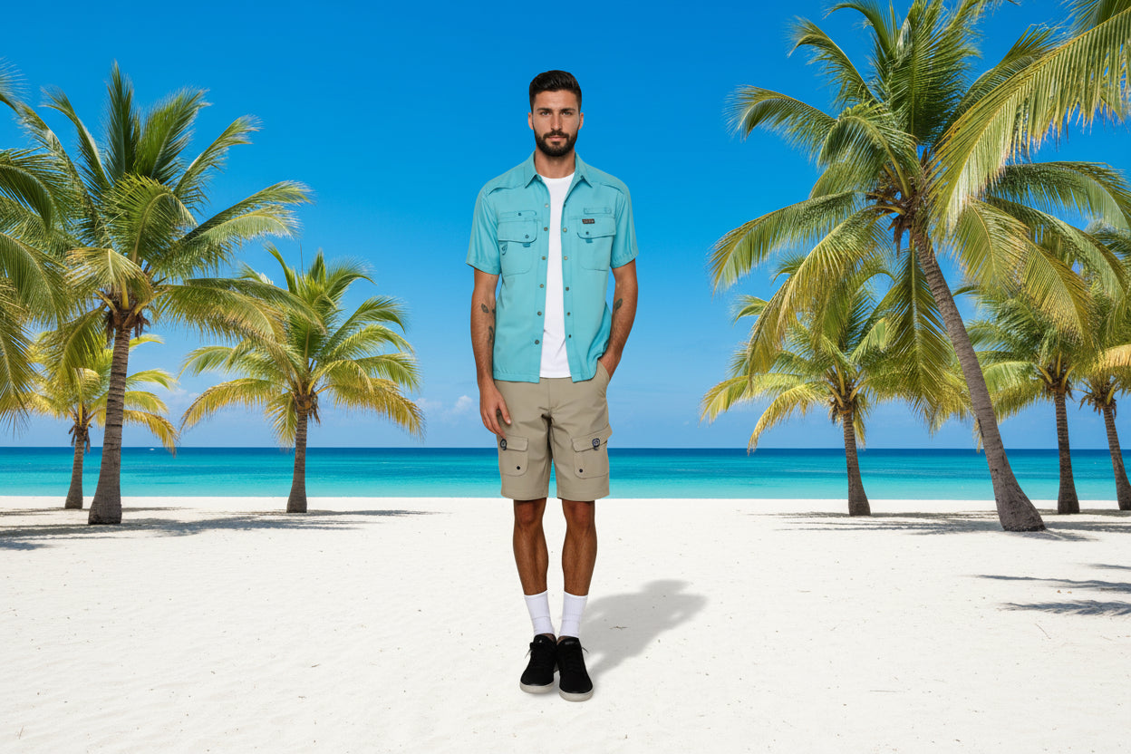 Man wearing a light blue shirt and beige shorts on a white background