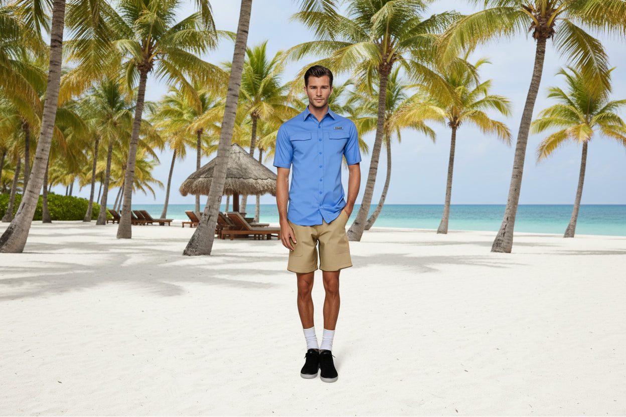 Man wearing a blue shirt and beige shorts on a white background
