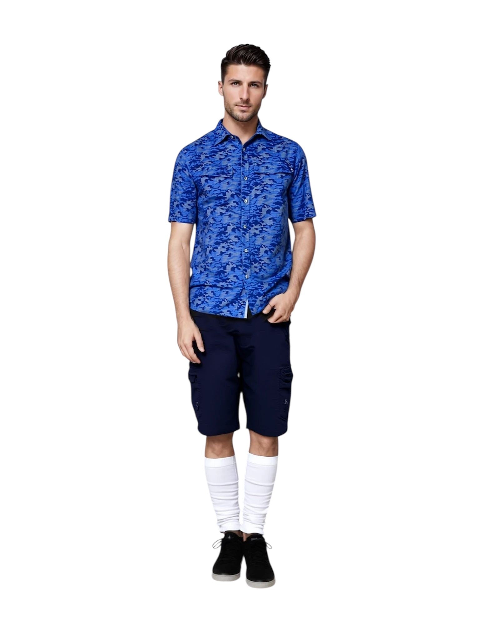 Man wearing a blue patterned shirt and navy shorts on a white background