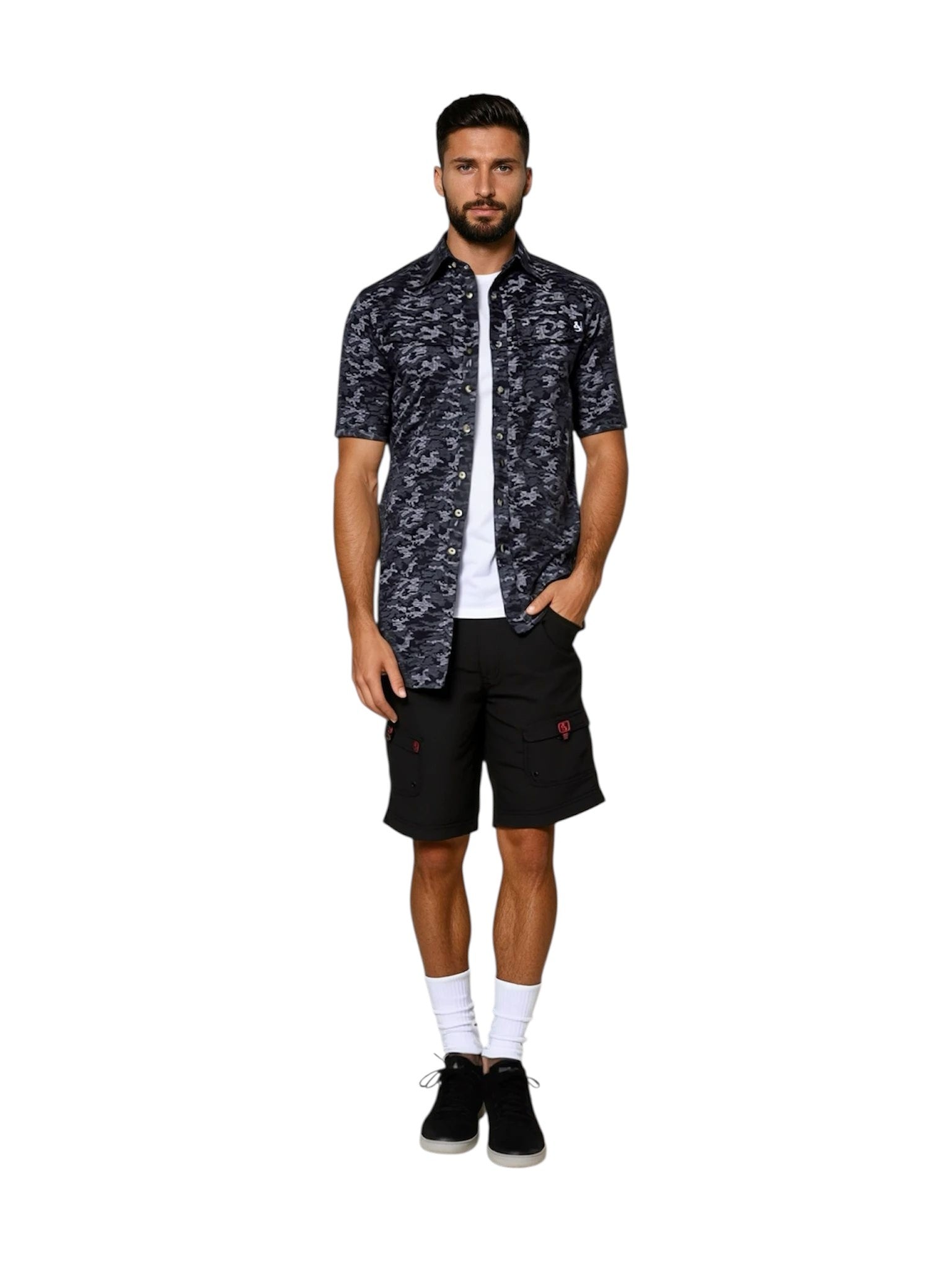 Man wearing a patterned shirt and black shorts on a white background