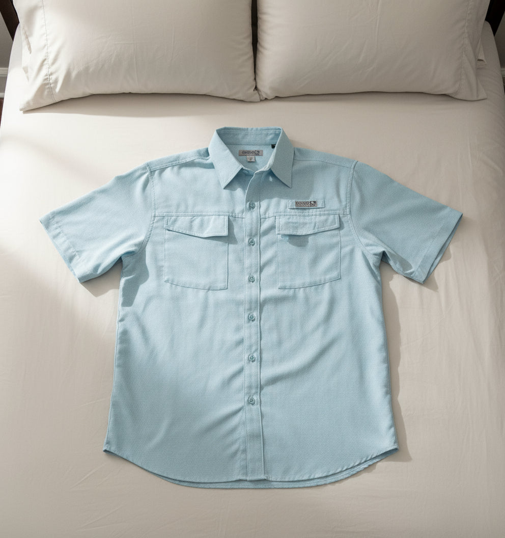 Light blue short-sleeve shirt with a brand logo on a white background