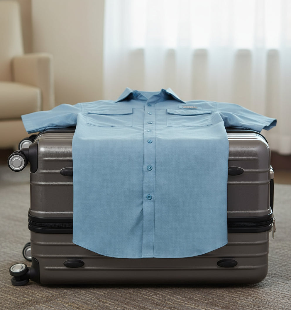Blue short-sleeve button-up shirt on a white background