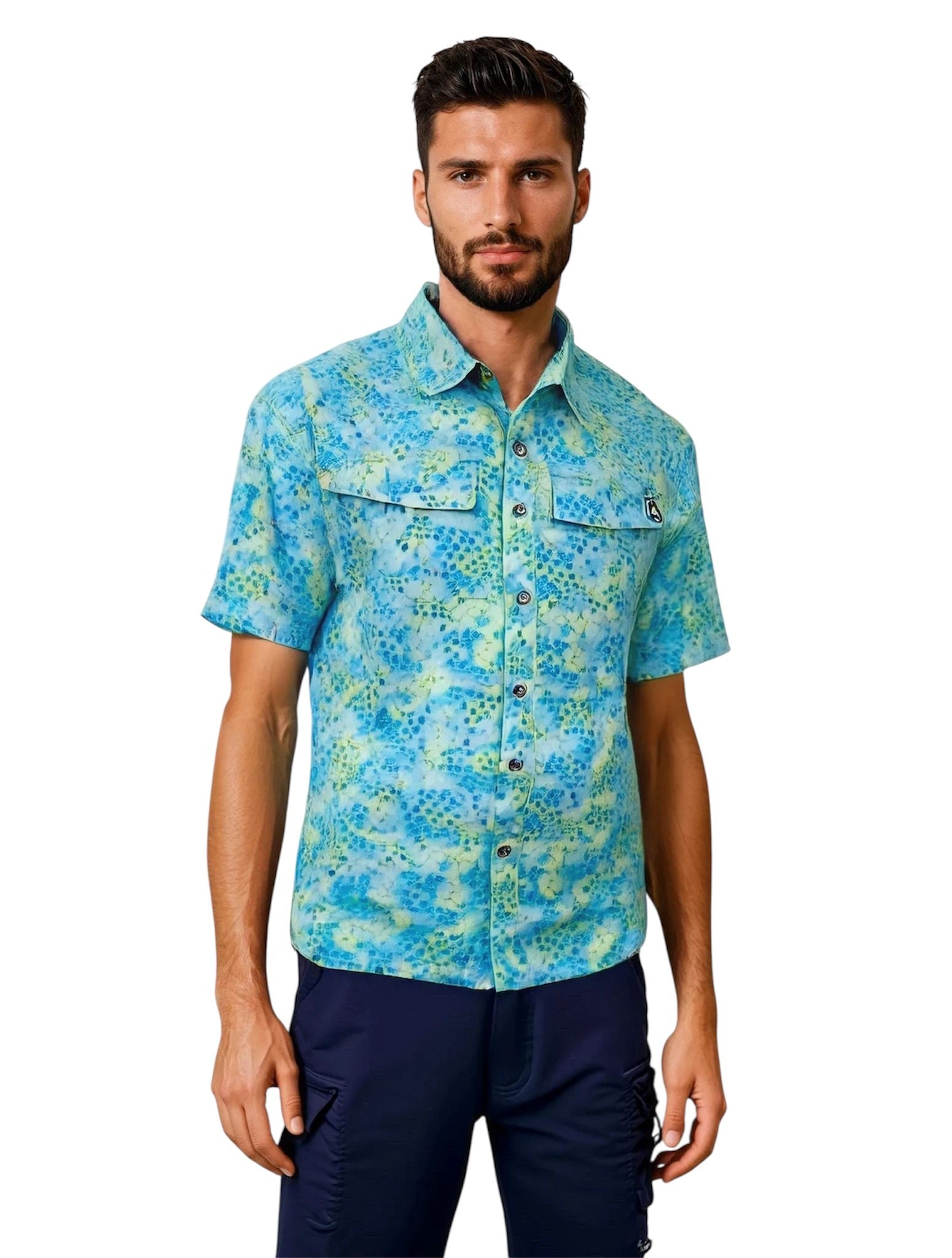 Man wearing a blue patterned shirt and navy pants on a white background
