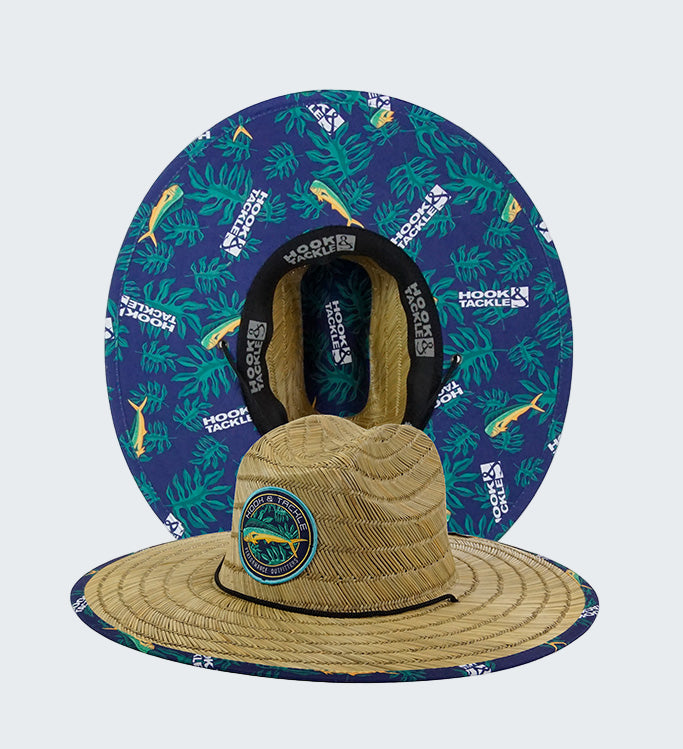 Tan straw hat with blue patterned headband on a white background