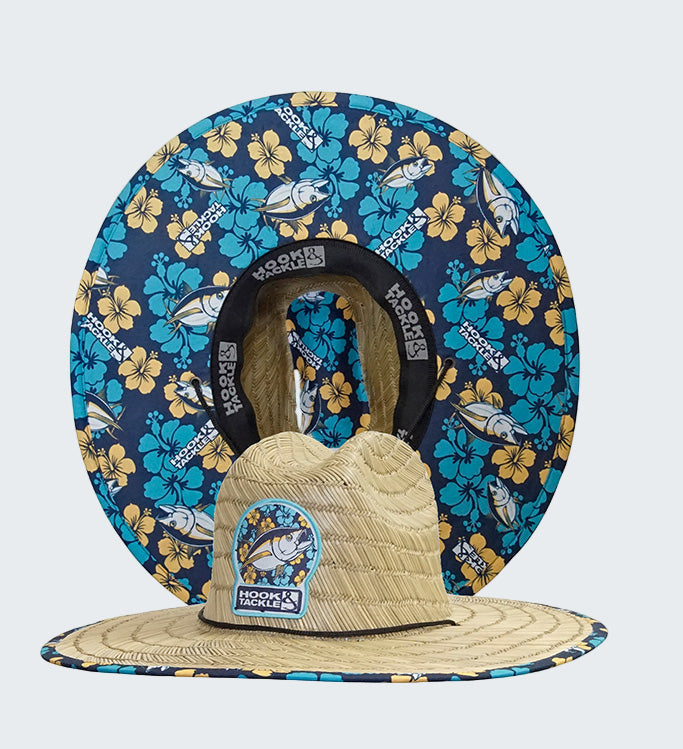 Wide-brimmed hat with floral and fish patterned visor on a white background