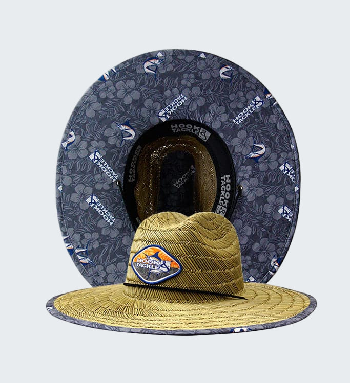 Yellow hat with a logo on a gray floral-patterned background