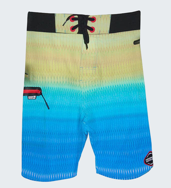 Gradient blue to yellow board shorts with a black and red accent on a white background