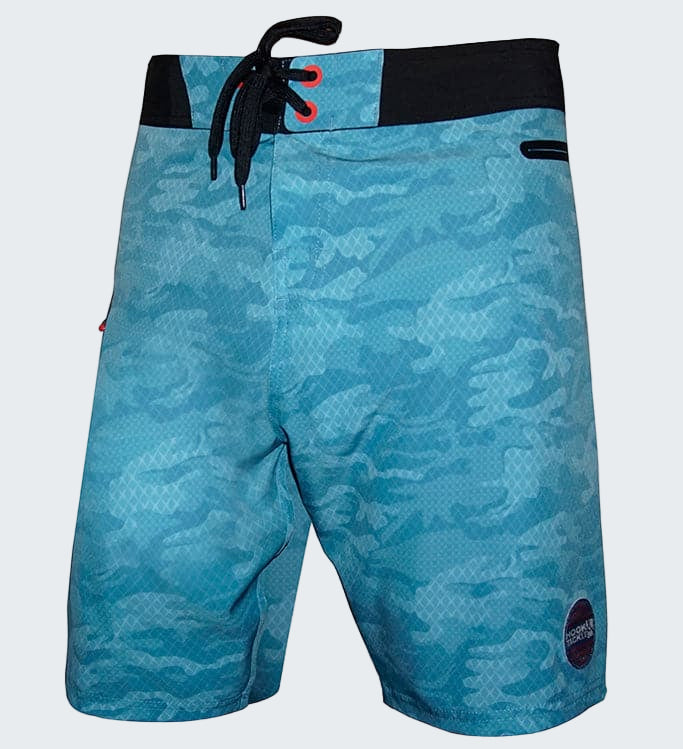 Blue camouflage board shorts with black waistband on a white background