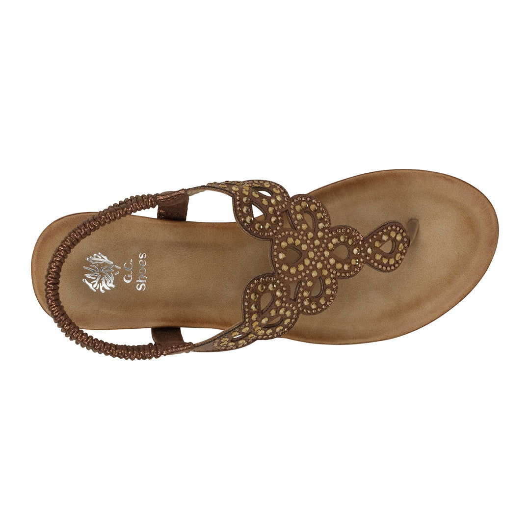 Brown sandal with decorative straps on a white background