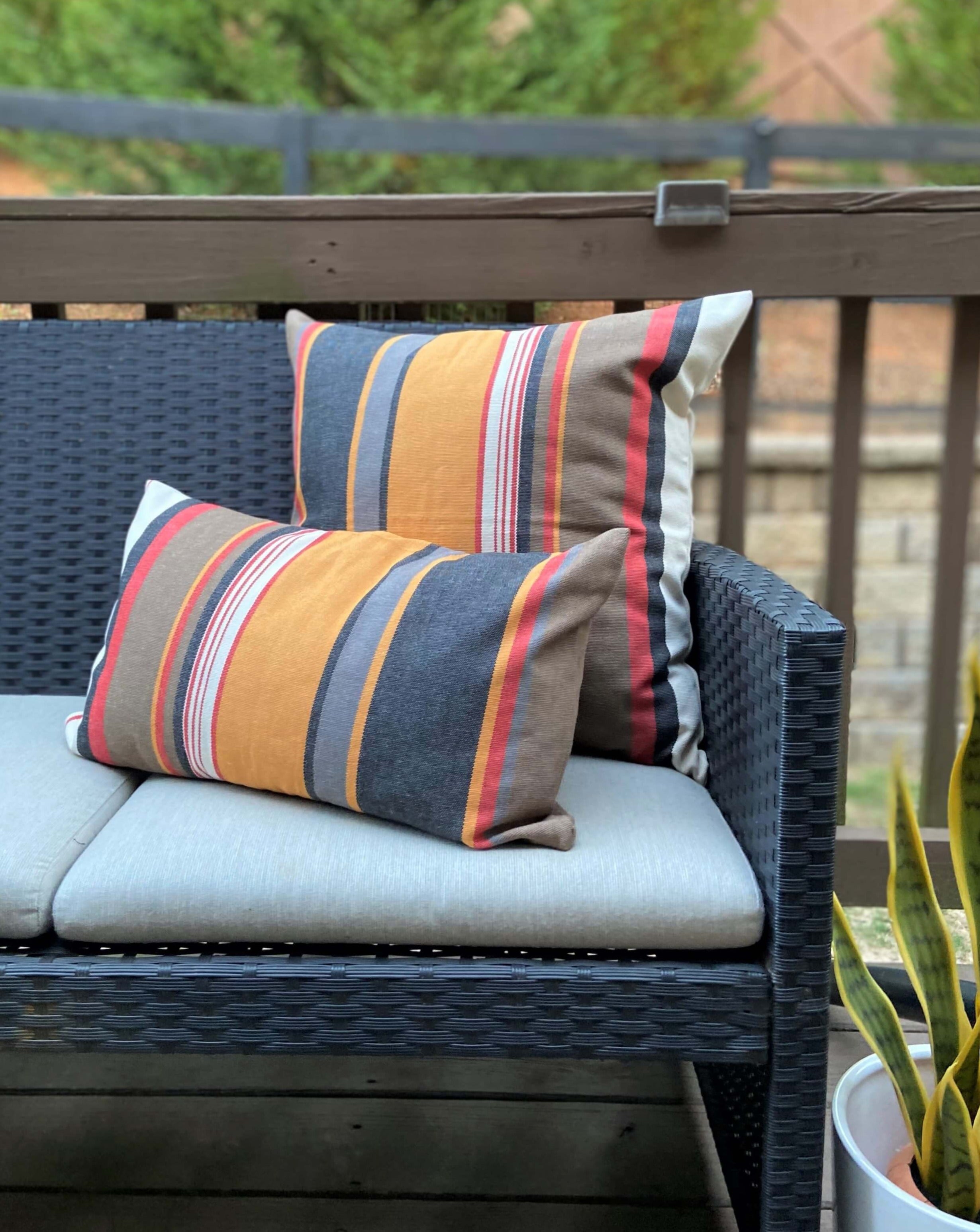 Outdoor furniture with striped cushions on a patio