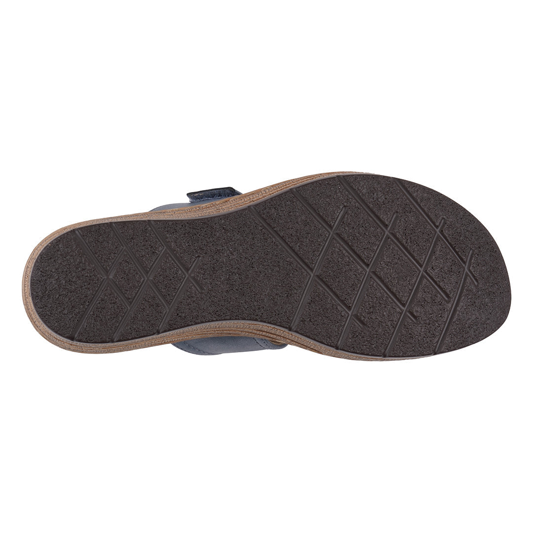 Dark gray sandal sole with a textured pattern on a white background