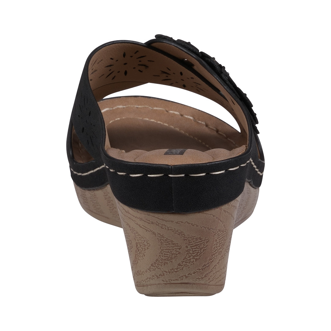 Brown sandal with black straps on a white background