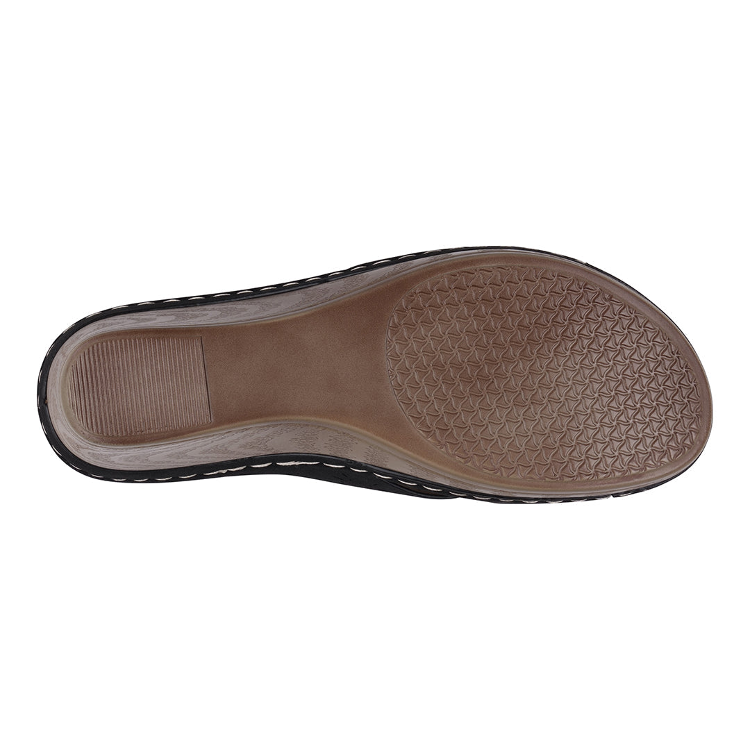 Brown shoe sole with textured pattern on a white background
