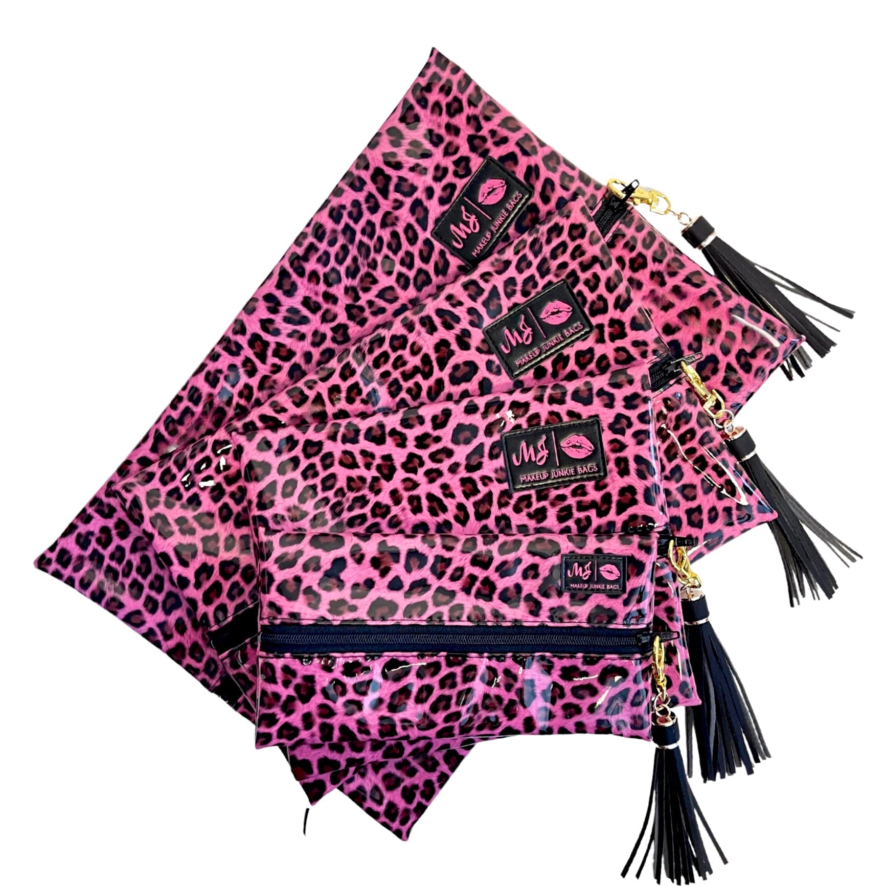 Pink leopard print bags with black tassels on a white background