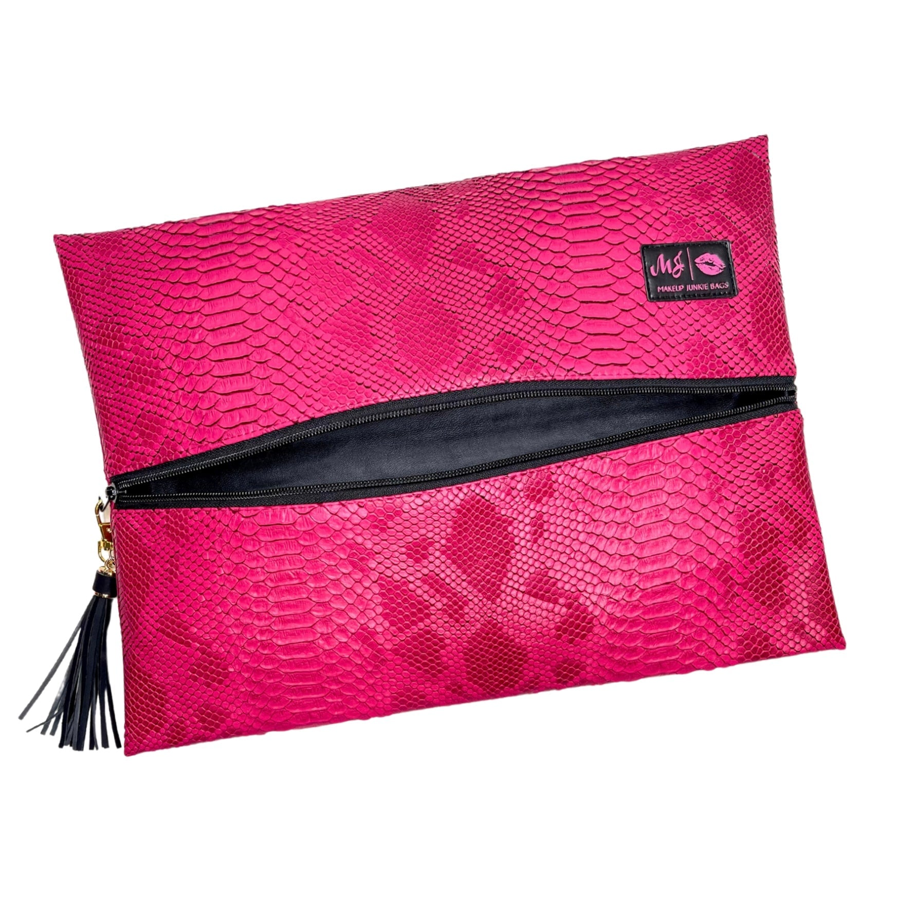 Pink textured clutch bag with black zipper and tassel on a white background