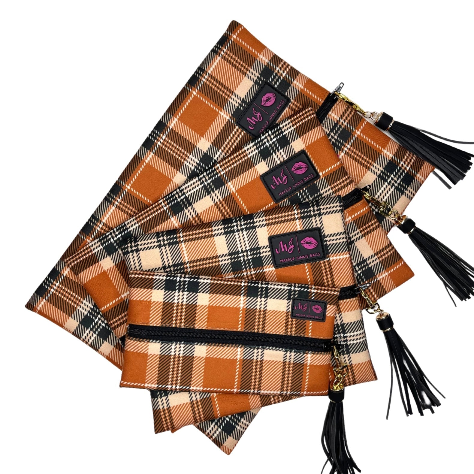 Plaid bags with black tassels and visible brand labels on a white background