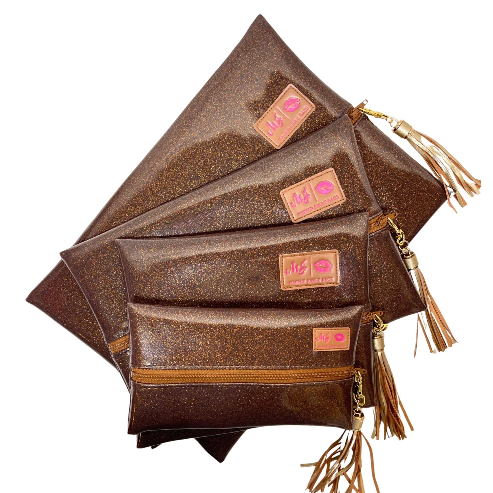 Stack of brown leather pouches with gold tassels on a white background