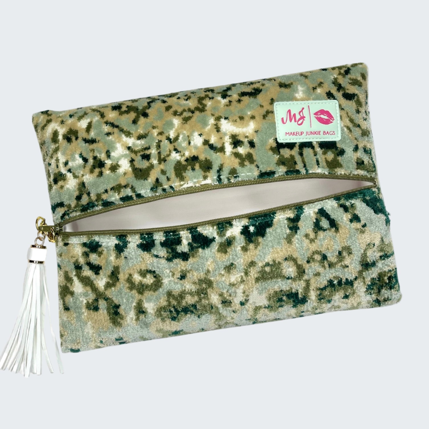 Camouflage-patterned pouch with a tassel on a white background
