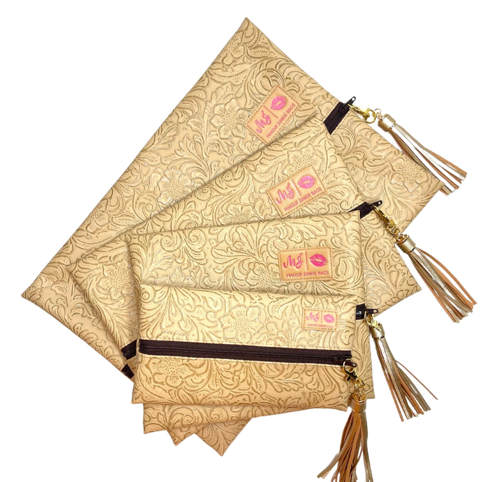 Set of gold patterned pouches with tassels on a white background
