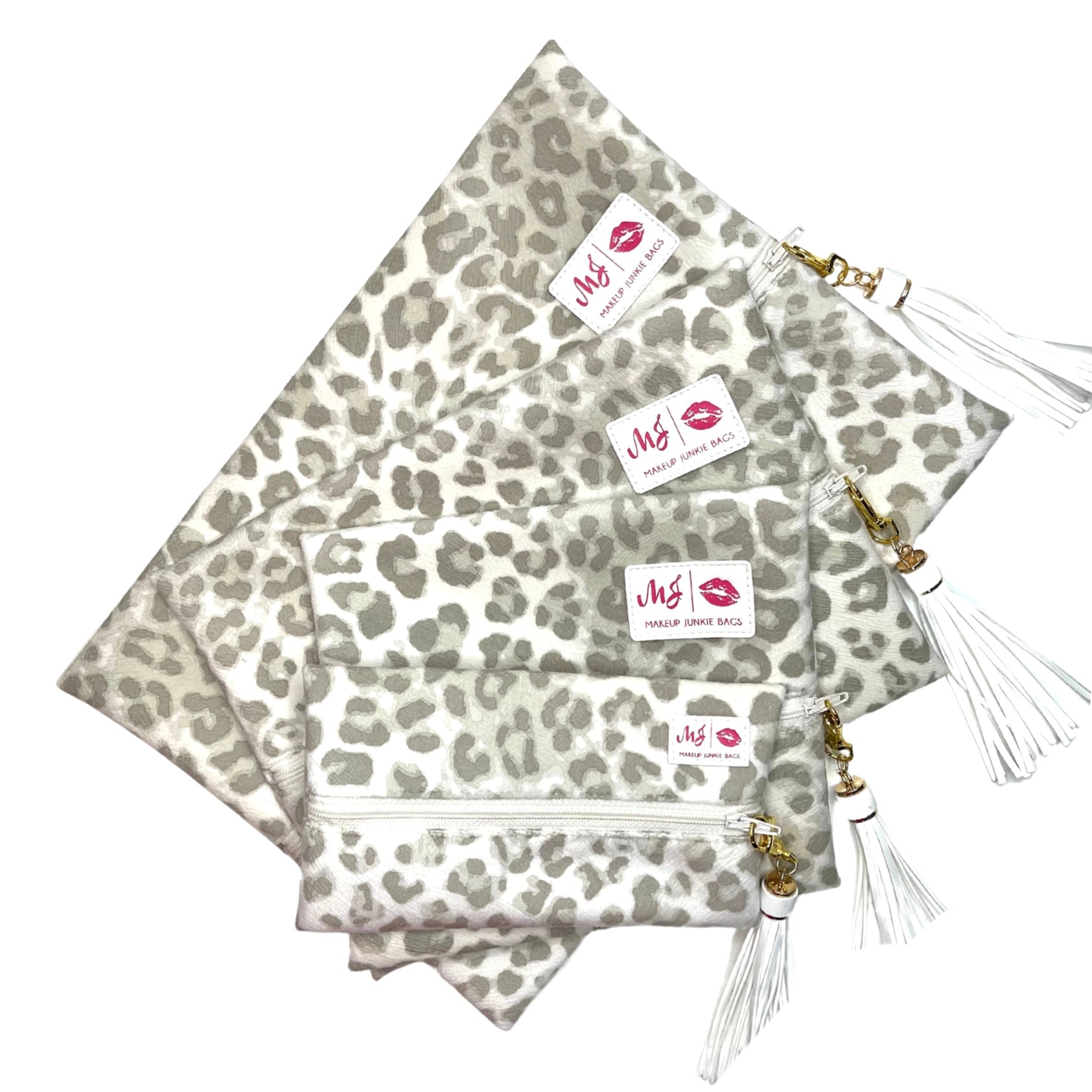Leopard print pouches with gold tassels and visible brand logo on a white background