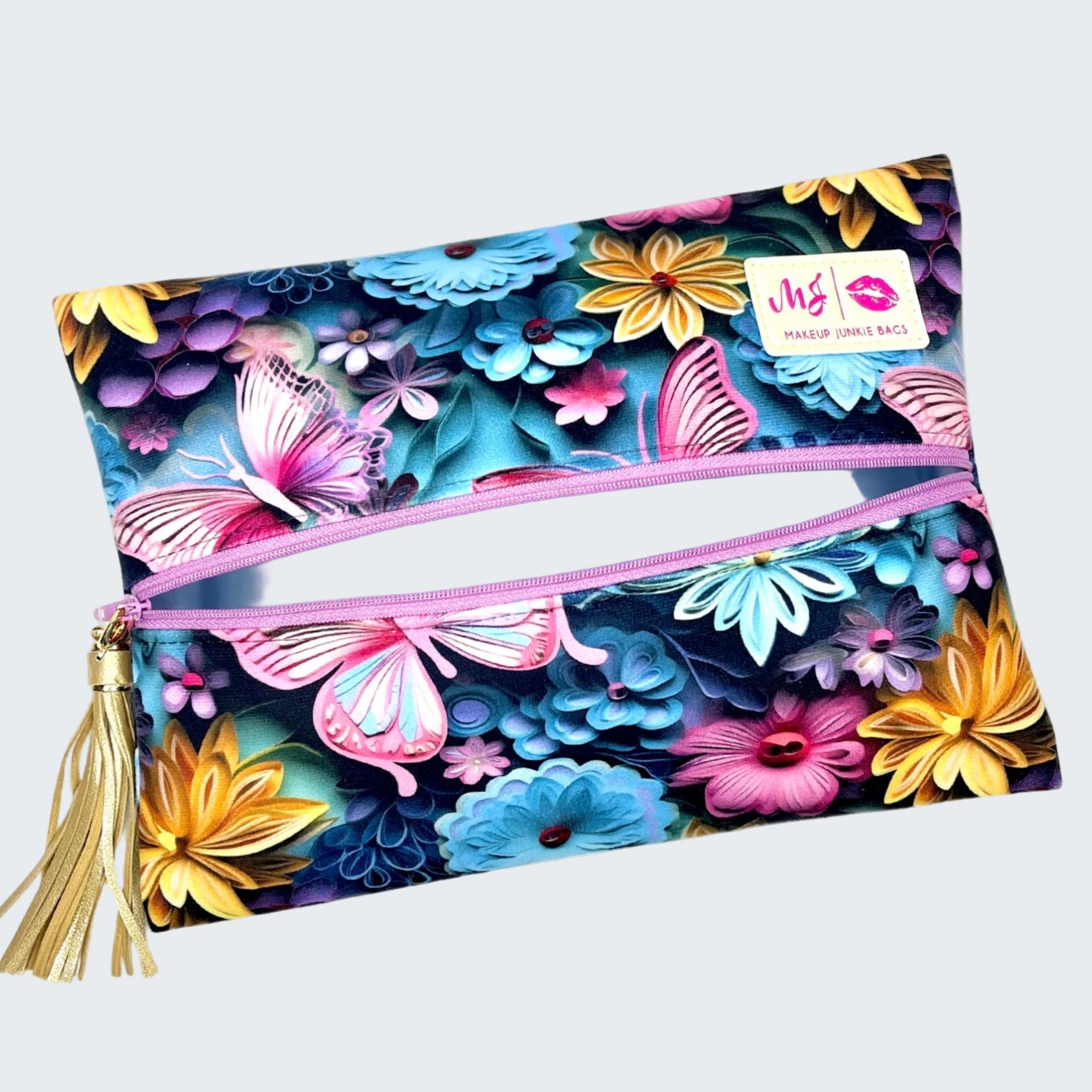Floral and butterfly patterned pouch with a pink zipper on a white background