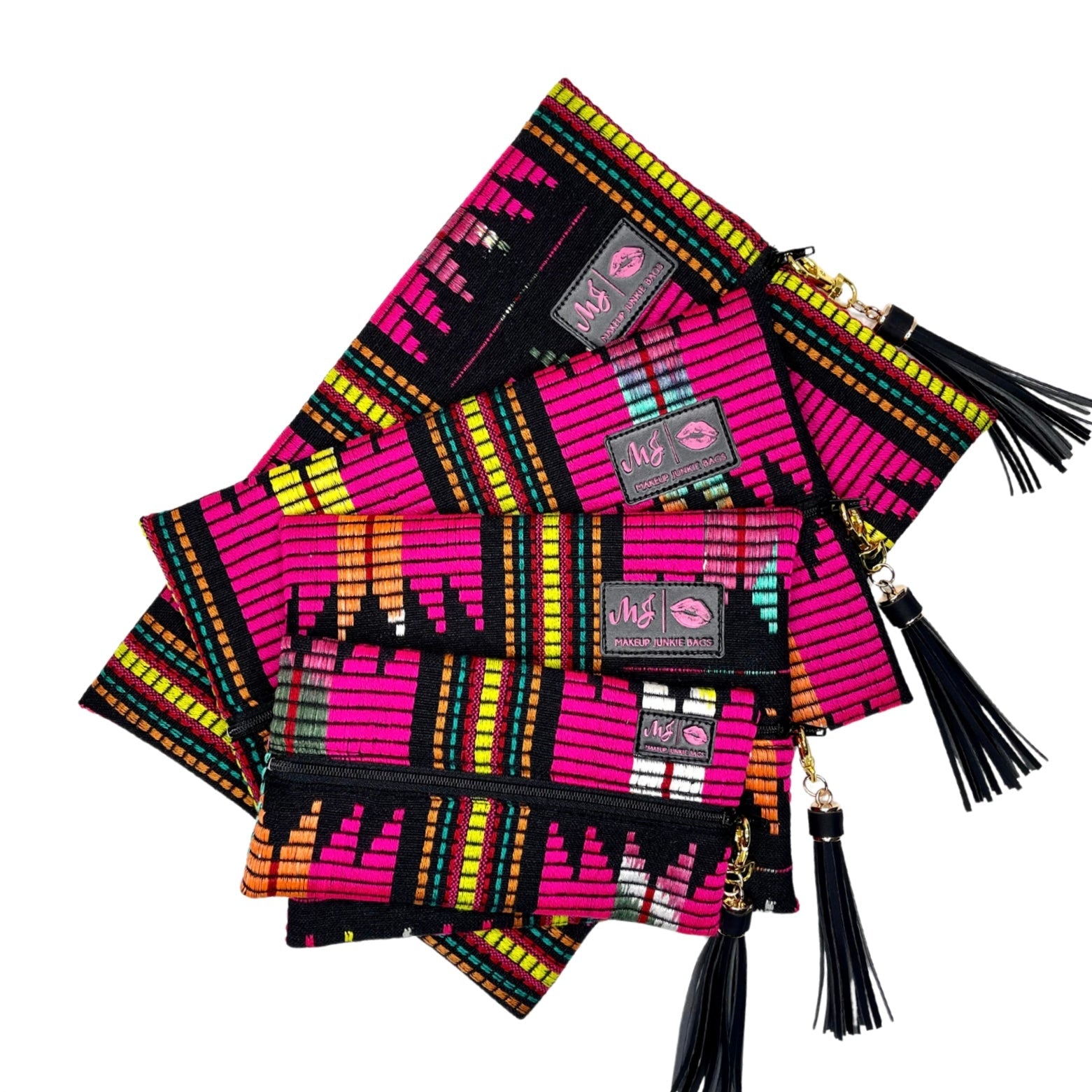 Colorful patterned pouches with tassels on a white background