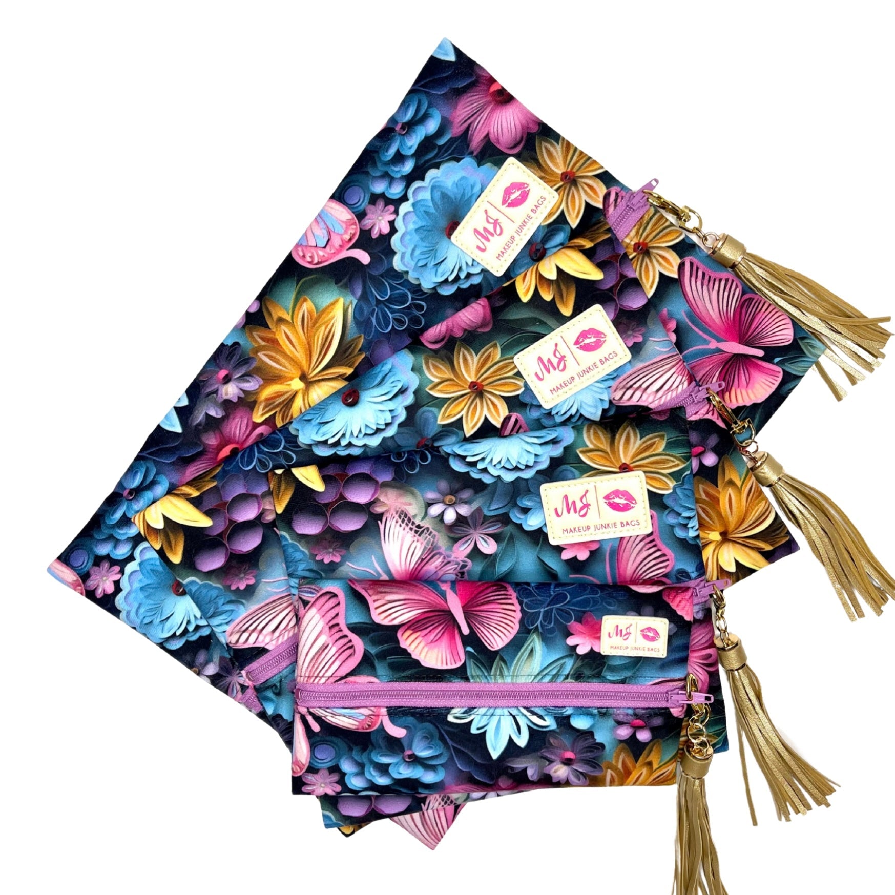 Colorful floral-patterned bags with tassels and visible brand name on a white background