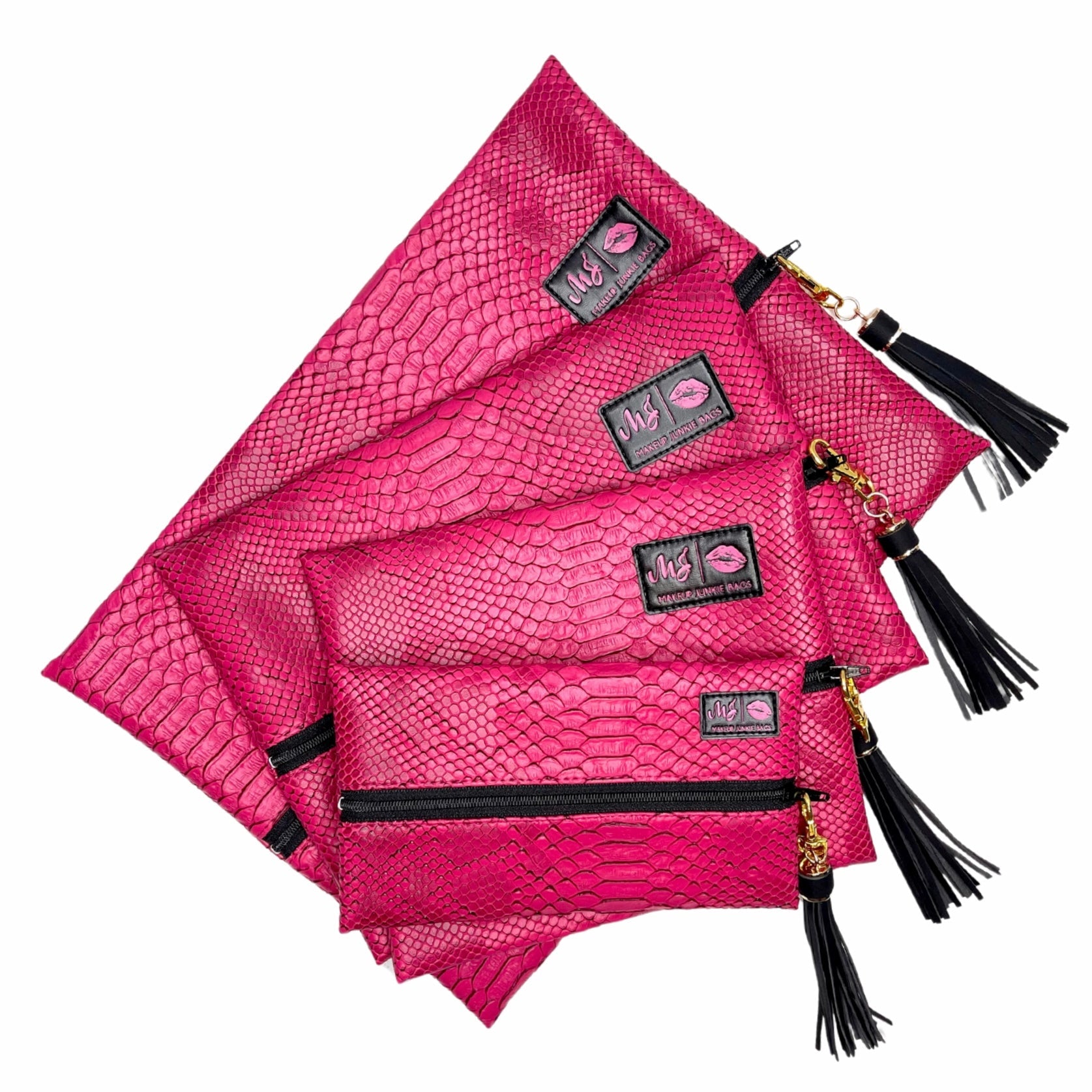 Set of pink textured pouches with black tassels on a white background
