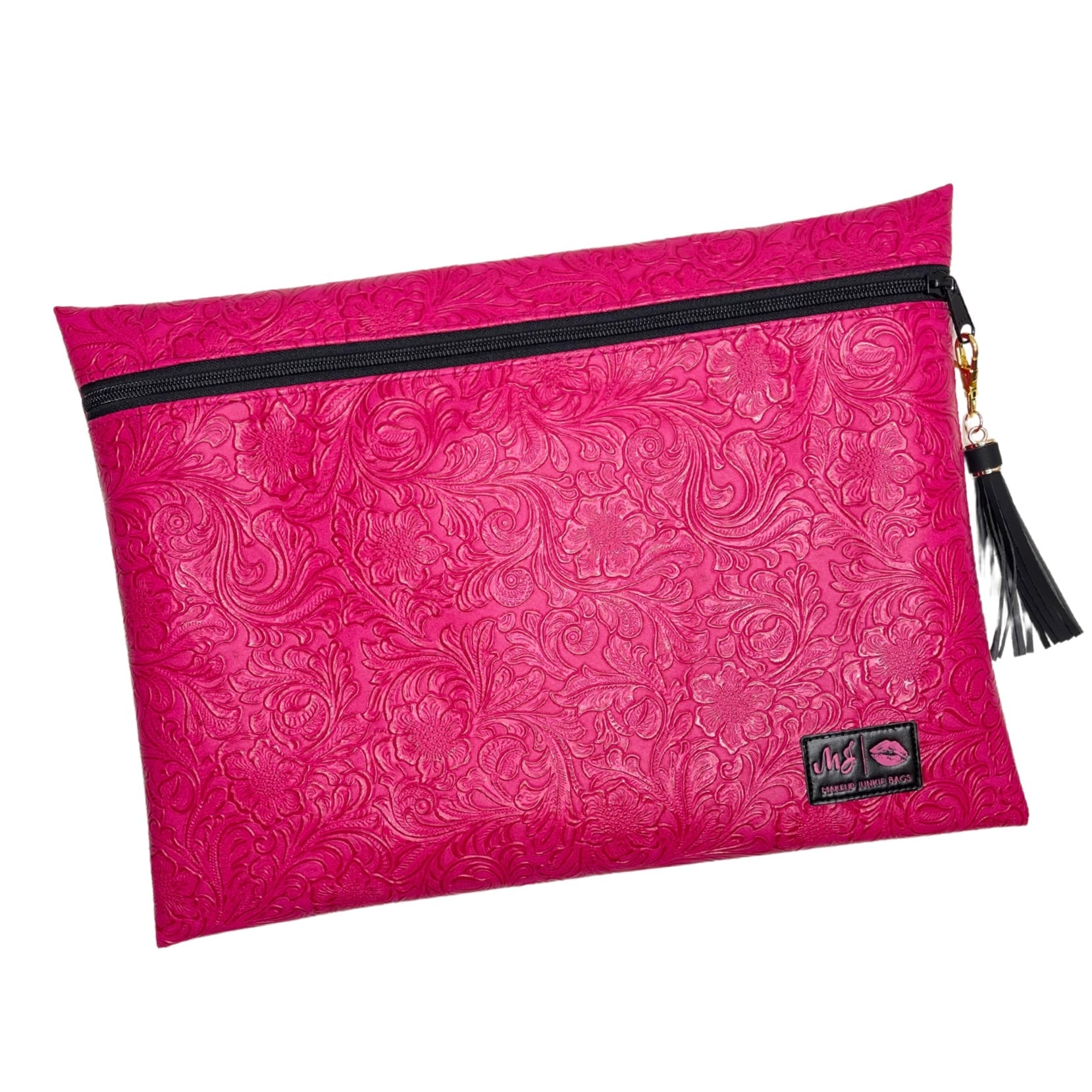 Pink pouch with black zipper and tassel on a white background