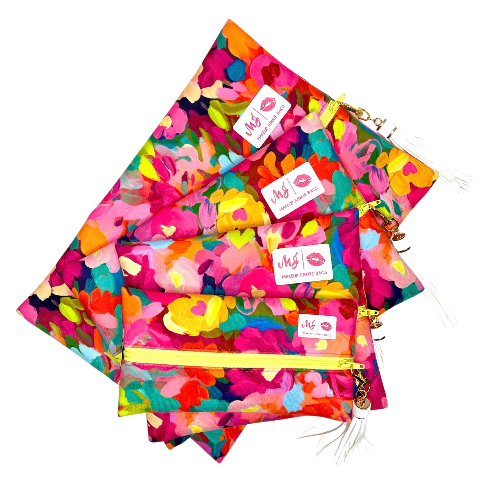 Colorful floral-patterned pouches with visible brand labels on a white background