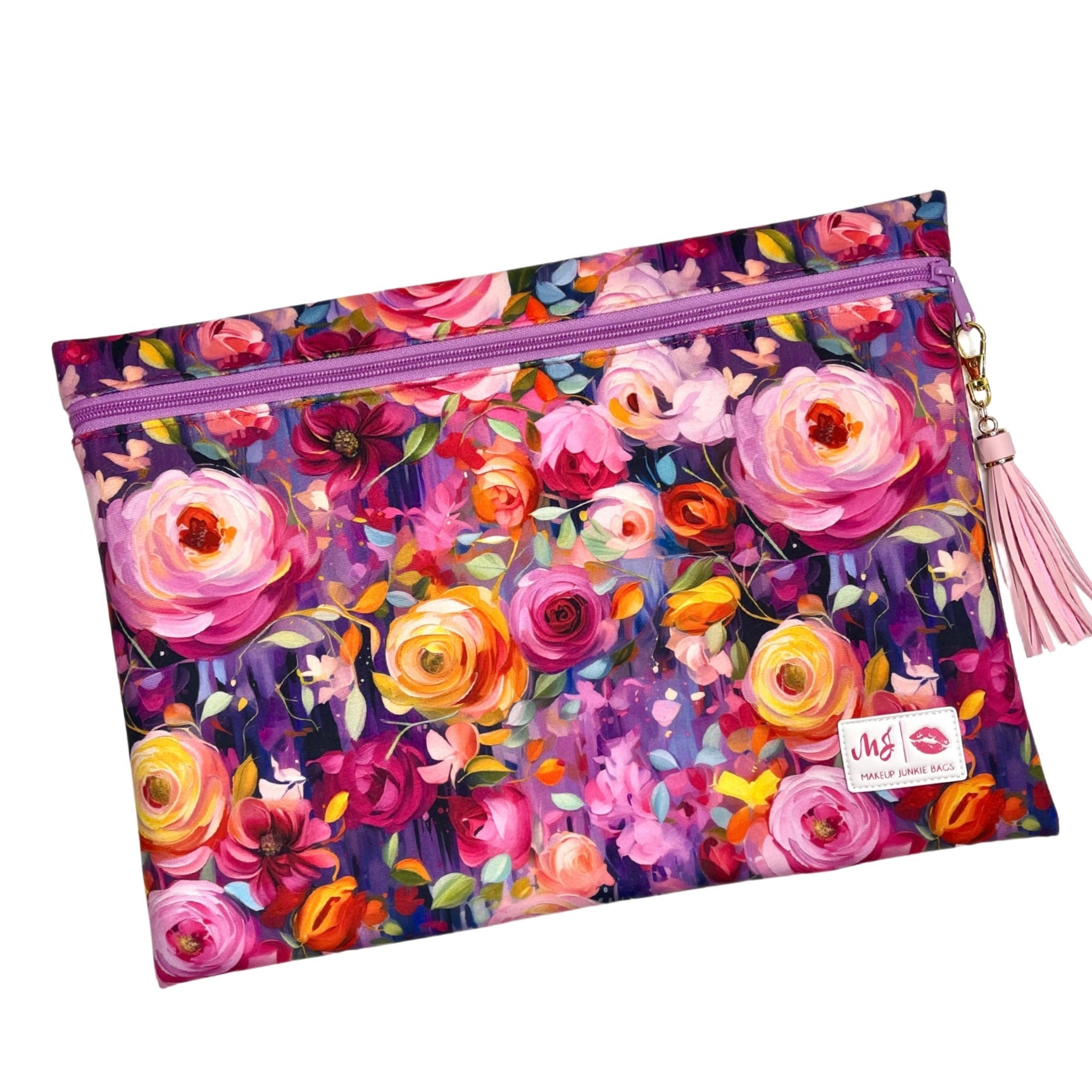 Floral patterned pouch with a pink zipper and tassel on a white background