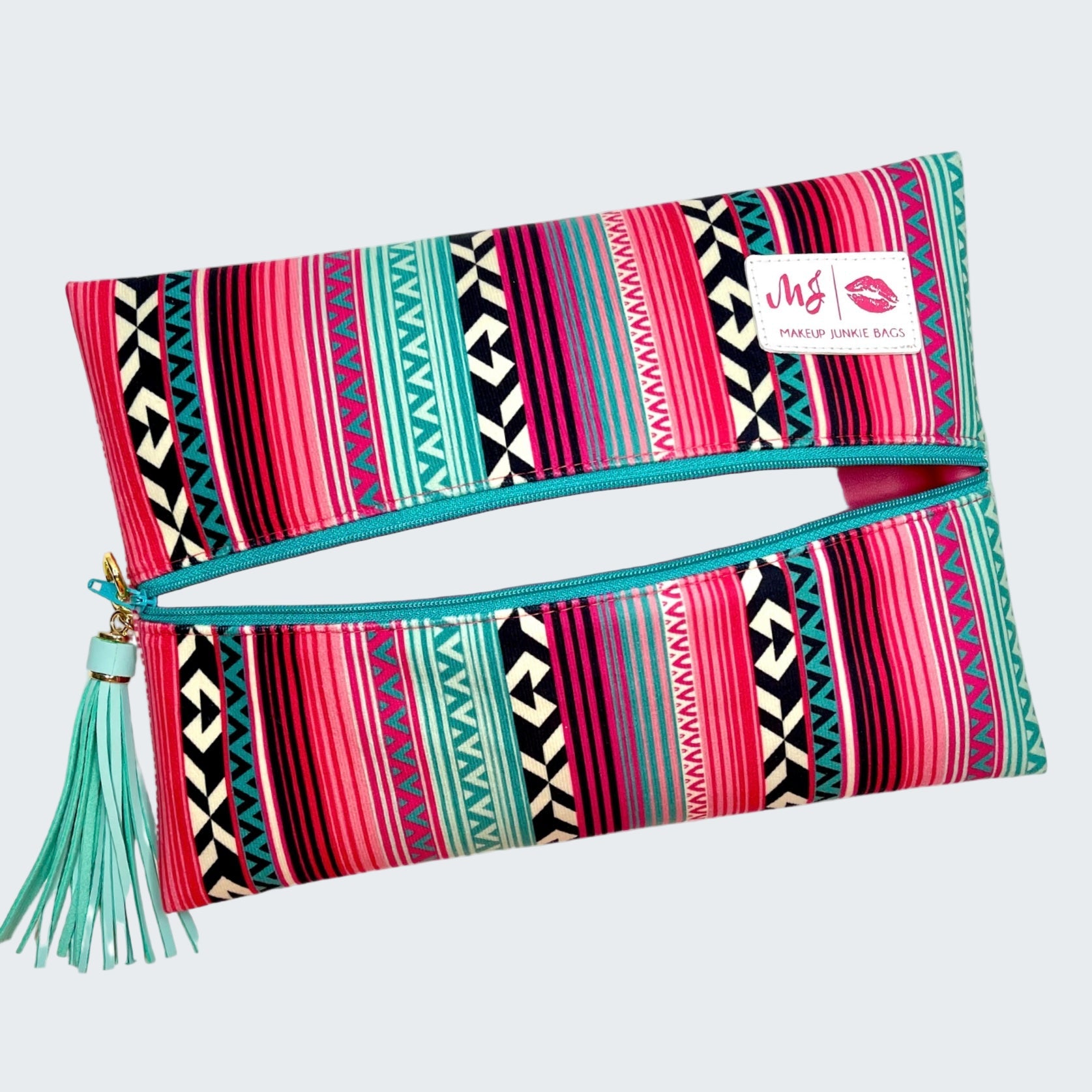 Colorful patterned pouch with a tassel on a white background